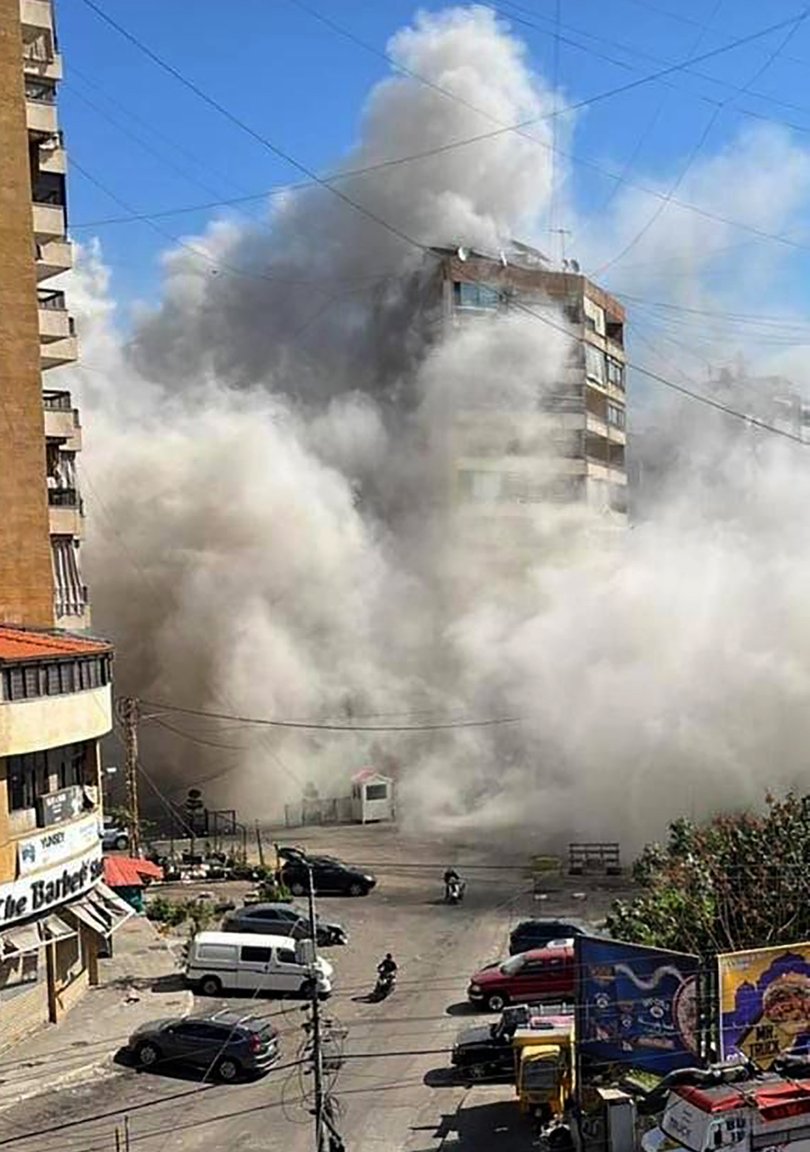 Smoke rises after an explosion from a missile strike in Dahieh, in Beirut.