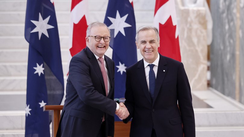 Prime Minister Anthony Albanese shakes hands with Canada's Prime Minister Mark Carney during a ceremonial welcome at Australian Parliament House on March 05, 2026 in Canberra, Australia.