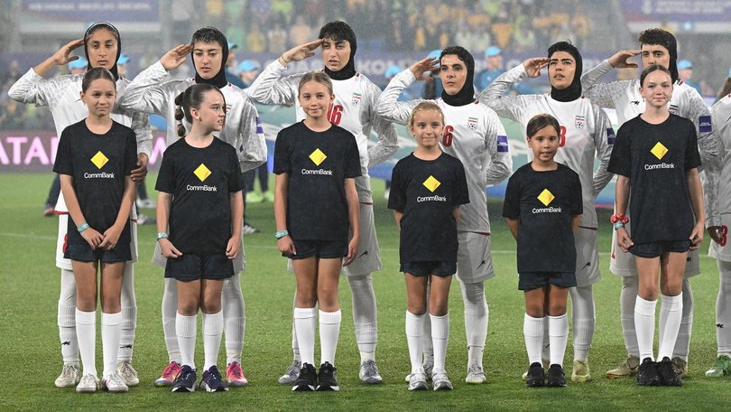 Iran players saluted instead of singing their national anthem before the Matildas match. (Dave Hunt/AAP PHOTOS)