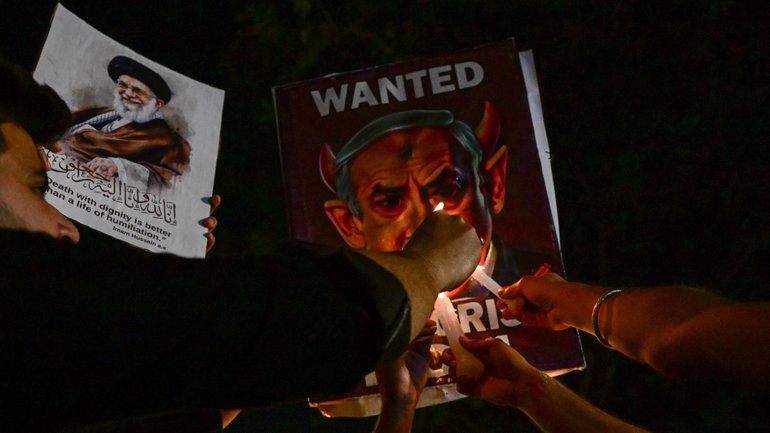 Protesters burn a poster of Israeli Prime Minister Benjamin Netanyahu after strikes on Iran killed Supreme leader Ayatollah Khamenei.