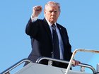 President Donald Trump holds up a fist as he boards Air Force One at Palm Beach International Airport in West Palm Beach, Fla., on Sunday, March 1, 2026. A day after a joint U.S.-Israeli military operation unleashed a bombing wave across Iran and killed Iran's supreme leader, the attacks intensified on Sunday by land and sea. (Eric Lee/The New York Times)