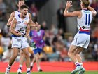The Western Bulldogs have scored a thrilling five-point win over premiers Brisbane at the Gabba.