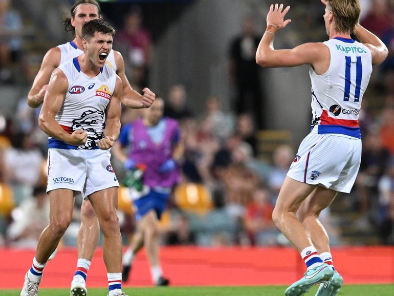 The Western Bulldogs have scored a thrilling five-point win over premiers Brisbane at the Gabba.