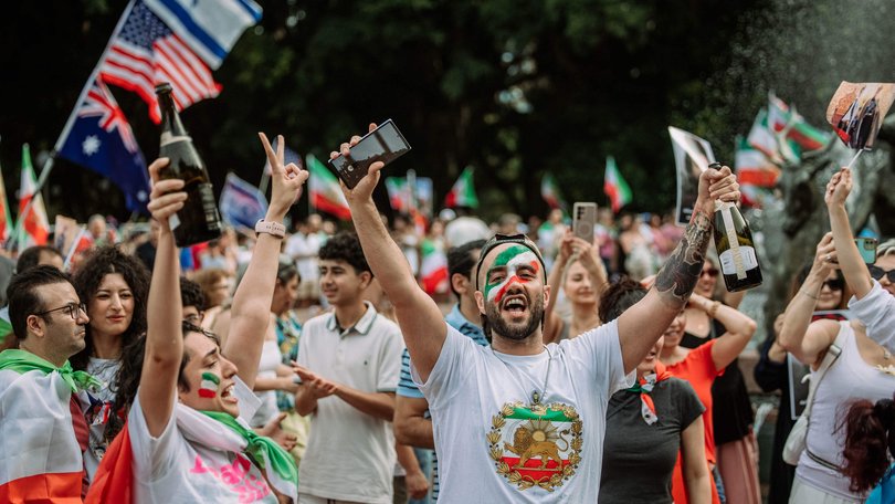 Iranian diaspora celebrate the end of Iran Supreme Leader Ayatollah Ali Khamenei’s reign in Hyde Park, Sydney. 