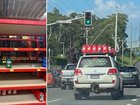 Bunnings shelves sit empty where jerry cans should be while a LandCruiser is loaded with jerry cans.