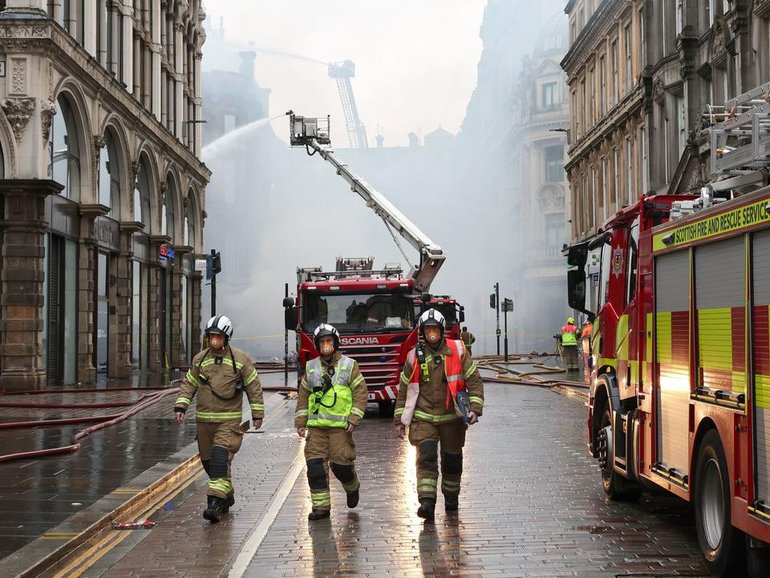 Scottish rail services have been crippled after a fire broke out near a busy Glasgow train station. (AP PHOTO)