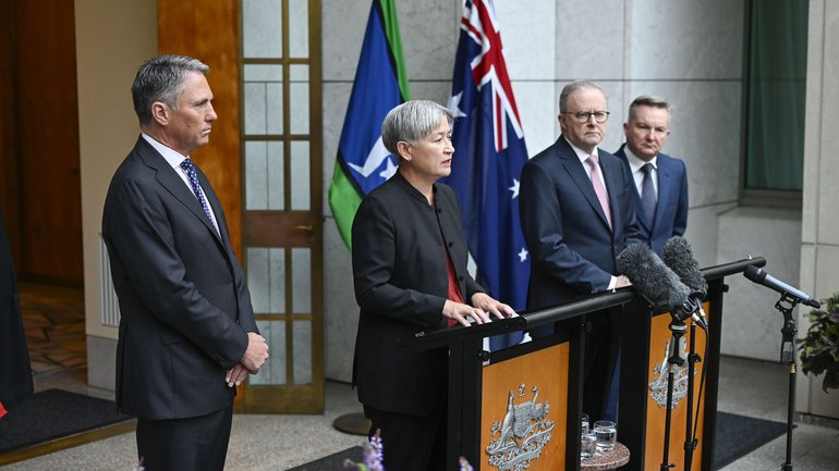 CANBERRA, AUSTRALIA - NewsWire Photos March 10, 2026: Prime Minister Anthony Albanese, Deputy Prime Minister Richard Marles, Foreign Minister Senator Penny Wong, and Climate Change and Energy Minister Chris Bowen address the media at Parliament House. The Prime Minister confirmed that five members of the Iranian women's soccer teamÃ¢â¬âZahra Ghanbari, Fatemeh Pasandideh, Zahra Sarbali, Atefeh Ramazanzadeh, and Mona HamoudiÃ¢â¬âhave been granted humanitarian visas following their defection during the Women's Asian Cup. Ministers also addressed the impact of the Middle East conflict on domestic fuel prices and national security. NewsWire /Martin Ollman