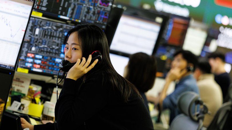 A foreign exchange dealer works inside a trading room at Hana Bank in South Korea on March 9, 2026. 