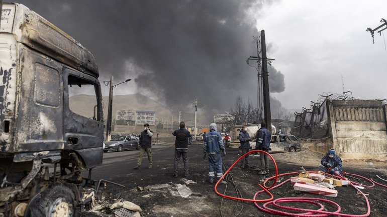 Smoke billows after overnight airstrikes on oil depots on in Tehran.