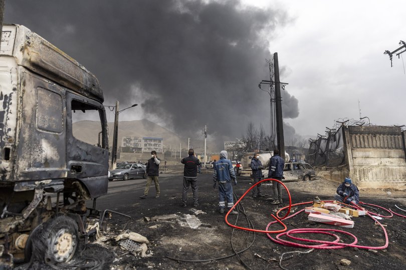 Smoke billows after overnight airstrikes on oil depots on in Tehran.