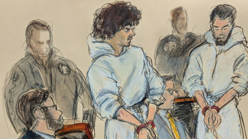 Emir Balat, left, and Ibrahim Kayumi, far right, are escorted into Manhattan federal court in New York.