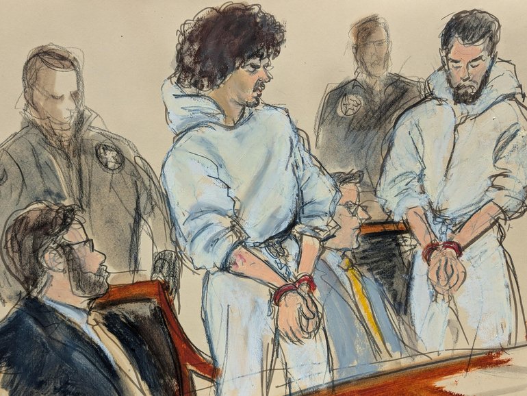 Emir Balat, left, and Ibrahim Kayumi, far right, are escorted into Manhattan federal court in New York.