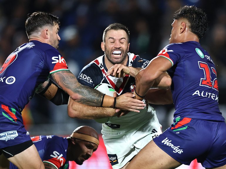 AUCKLAND, NEW ZEALAND - MARCH 06: James Tedesco of the Roosters is tackled during the round one NRL match between New Zealand Warriors and Sydney Roosters at Go Media Stadium, on March 06, 2026, in Auckland, New Zealand. (Photo by Phil Walter/Getty Images)