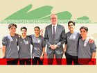 Tony Burke with five women from the Iranian women’s soccer team who have been granted asylum in Australia.