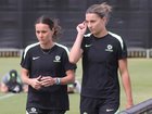 Hayley Raso and Steph Catley walk laps during training on Thursday.