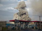 A plume of smoke rises after an explosion in Tehran.