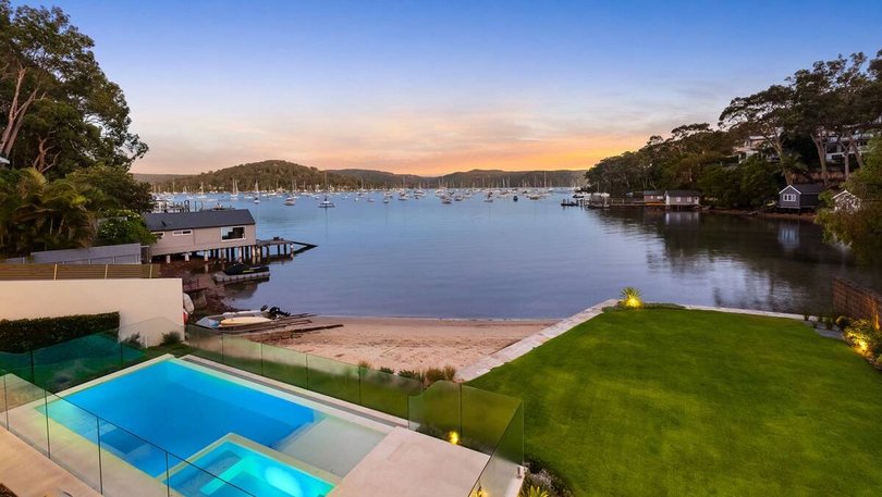 The newly-built home features its own private patch of sand on the Pittwater.