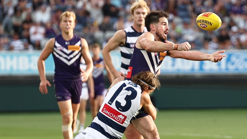 Andrew Brayshaw of the Dockers is tackled by Jhye Clark.