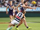 Andrew Brayshaw of the Dockers is tackled by Jhye Clark.