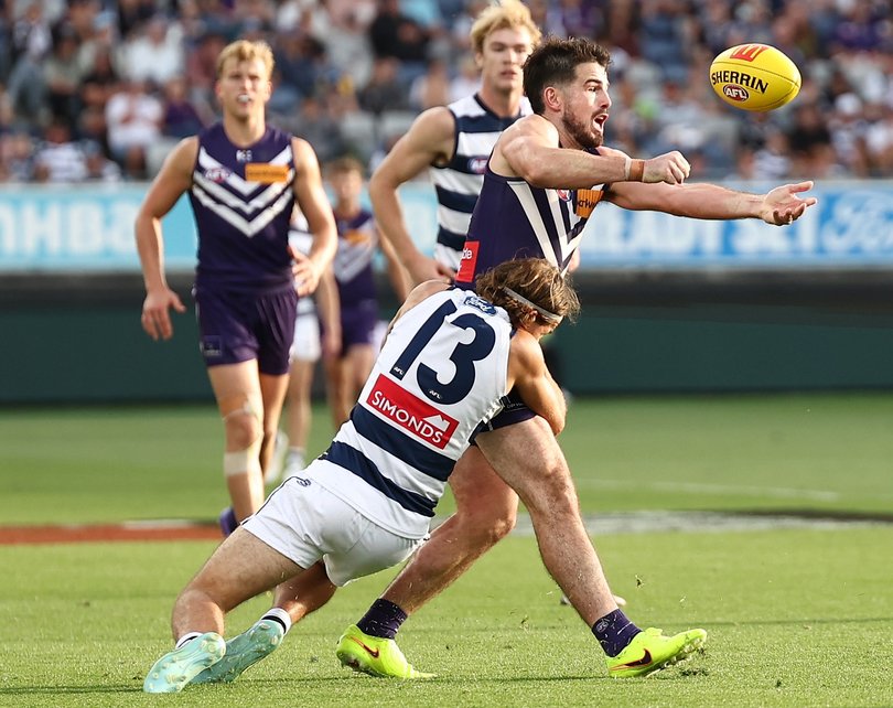 Andrew Brayshaw of the Dockers is tackled by Jhye Clark of the Cats.