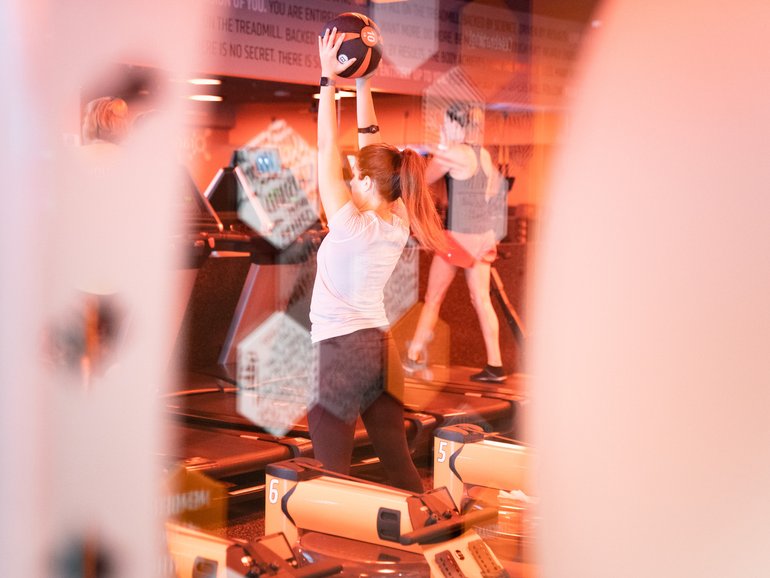 Clients participate in a class at an Orangetheory Fitness gym in Atlanta. 