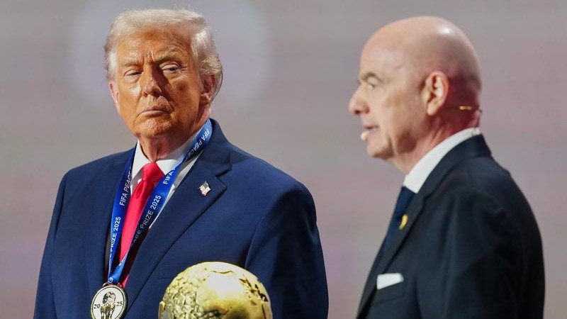 Donald Trump, here attending the World Cup draw, says it's not appropriate for Iran to compete. 