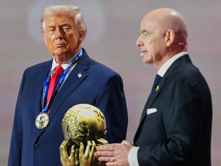 Donald Trump, here attending the World Cup draw, says it's not appropriate for Iran to compete. 