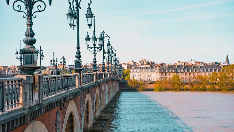 Le Pont de Pierre crossing the Garonne river, Bordeaux, France.