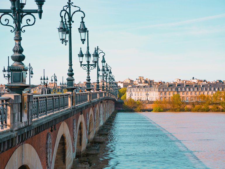 Le Pont de Pierre crossing the Garonne river, Bordeaux, France.