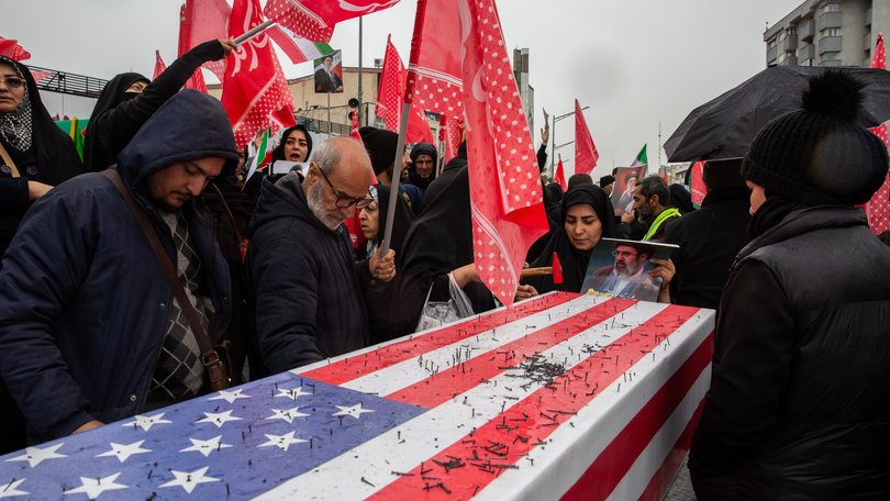 In a symbolic gesture of hatred, nails are hammered into a mock American flag-draped coffin during a rally on Iran’s Quds Day (Jerusalem Day), an annual pro-Palestinian, anti-Zionism event, in Tehran, Iran, March 13, 2026. Ever since Iran’s Islamic Revolution in 1979, which toppled a brutally repressive, staunch American ally, the two country’s governments have repeatedly cast the other as evil. (Arash Khamooshi/The New York Times)