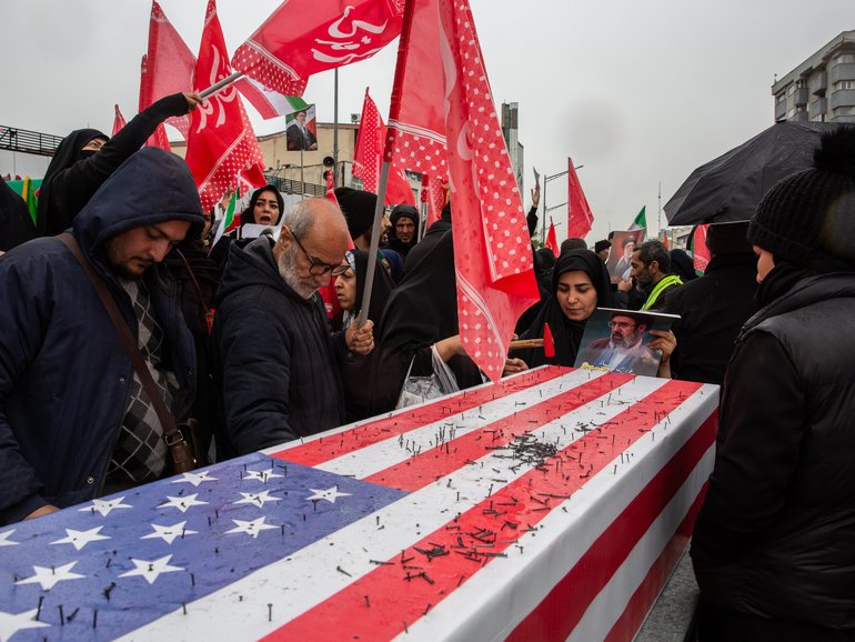 In a symbolic gesture of hatred, nails are hammered into a mock American flag-draped coffin during a rally on Iran’s Quds Day (Jerusalem Day), an annual pro-Palestinian, anti-Zionism event, in Tehran, Iran, March 13, 2026. Ever since Iran’s Islamic Revolution in 1979, which toppled a brutally repressive, staunch American ally, the two country’s governments have repeatedly cast the other as evil. (Arash Khamooshi/The New York Times)
