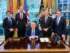 US President Donald Trump and Secretary of the Interior Doug Burgum together with Rio Tinto CEO, Jakob Stausholm, incoming CEO Simon Trott and BHP chief Mike Henry.