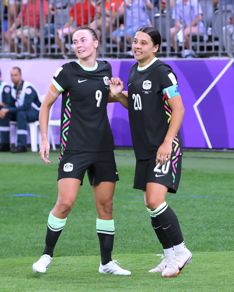 Caitlin Foord and Sam Kerr celebrate.