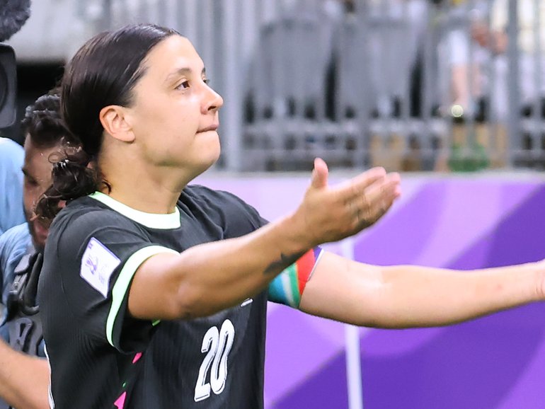 Matildas captain Sam Kerr revs up the crowd after scoring a goal.