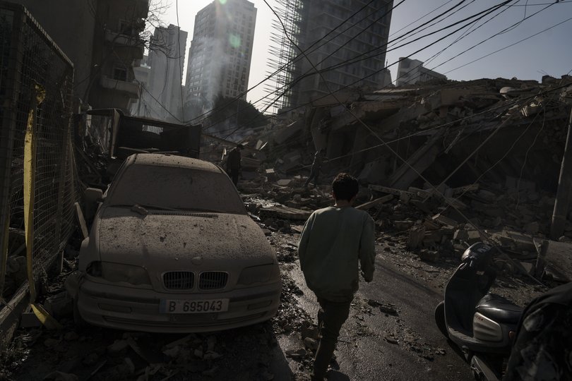 People look at damaged buildings in the wake of an Israeli airstrike on March 18, 2026 in Beirut, Lebanon. 
