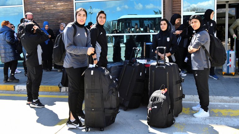 Members of the Iranian women's national soccer team outside the airport after they arrived in the eastern city of Igdir.