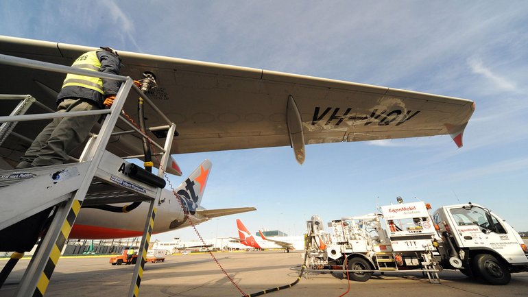 A Jetstar plane is refueled with Exxon Mobil fuel prior to take off, at Melbourne Airport.
