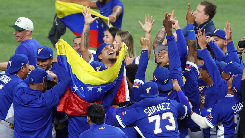 Members of Team Venezuela celebrate after the 3-2 victory against Team United States.