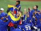 Members of Team Venezuela celebrate after the 3-2 victory against Team United States.