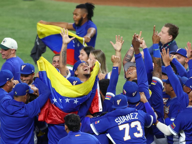 Members of Team Venezuela celebrate after the 3-2 victory against Team United States.
