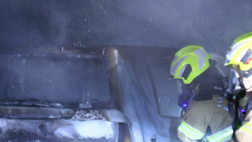 Firefighters extinguishing the blaze.