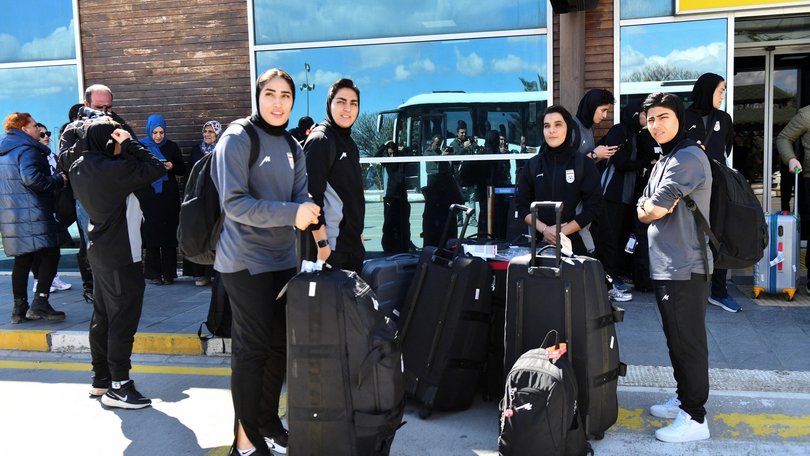 Members of the Iranian women's national soccer team outside the airport after they arrived in the eastern city of Igdir.