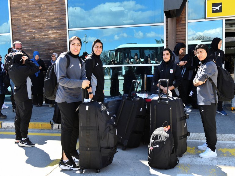 Members of the Iranian women's national soccer team outside the airport after they arrived in the eastern city of Igdir.