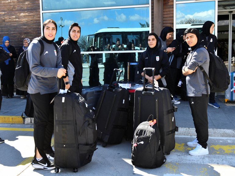 Members of the Iranian women's national soccer team outside the airport after they arrived in the eastern city of Igdir.