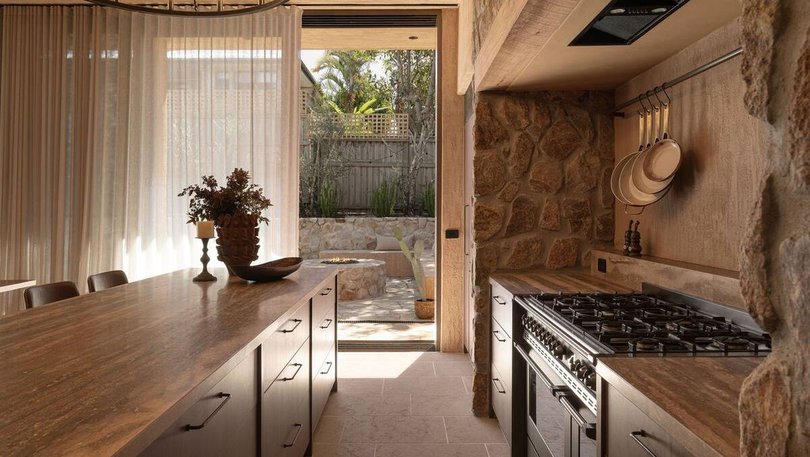 The kitchen overlooks the outdoor spaces. Pic: Harcourts.