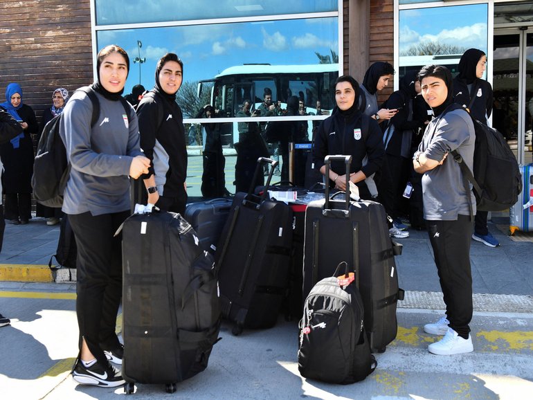 Members of the Iranian women's national soccer team outside the airport after they arrived in the eastern city of Igdir.