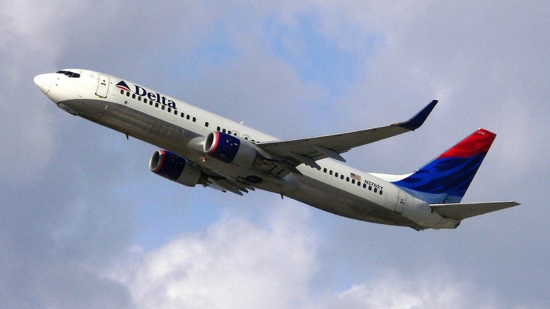 Eight people required medical treatment after the Delta Air Lines flight was hit with violent turbulence. 