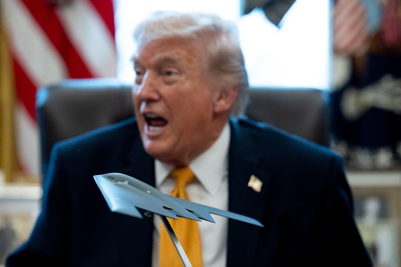 A model stealth bomber in front of US President Donald Trump during an executive order signing in the Oval Office of the White House in Washington, DC, US, on Monday.