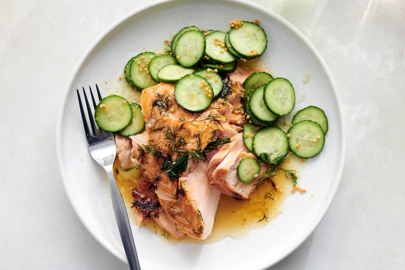 Lemon butter salmon with dill, and a pickled cucumber topping. The pickled cucumber sits as the salmon does, deepening in flavor. Food stylist: Rebecca Jurkevich.