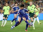Riko Ueki of Japan passes the ball.